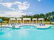 A community pool complex featuring comfortable lounge chairs, and clear blue water for relaxing by the poolside at 290 Watersglen Dr, Summerville, SC 29486