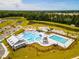 Aerial view of a community pool with beach entry, slide, lap pool and splash pad at 291 Watersglen Dr, Summerville, SC 29486