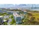 Stunning aerial view of modern apartment buildings with waterfront views and the Ravenel Bridge in the background at 341 Cooper River Dr, Mount Pleasant, SC 29464