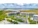 Beautiful aerial view showcasing condo buildings near the water with ample parking and the Ravenel Bridge backdrop at 341 Cooper River Dr, Mount Pleasant, SC 29464
