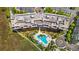 Aerial view of condo building with rooftop amenities, pool, and marsh views at 341 Cooper River Dr, Mount Pleasant, SC 29464