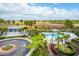 Aerial view of community pool, palm trees, and landscaping at Harbor House at 341 Cooper River Dr, Mount Pleasant, SC 29464