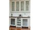 Stylish bar featuring glass-front cabinets, wine coolers, and ample storage for glassware and beverages at 341 Cooper River Dr, Mount Pleasant, SC 29464