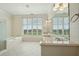 Spacious bathroom with marble floors and countertops, dual sinks, and natural light at 341 Cooper River Dr, Mount Pleasant, SC 29464