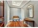 Elegant hallway featuring a vintage bench, wooden table, striking mirror, and a sophisticated gray textured wall at 341 Cooper River Dr, Mount Pleasant, SC 29464
