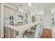 Modern kitchen with stainless steel appliances, marble countertops, white cabinets and large center island at 341 Cooper River Dr, Mount Pleasant, SC 29464
