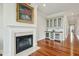 Elegant living area with fireplace and convenient bar area with wine storage and glass front cabinets at 341 Cooper River Dr, Mount Pleasant, SC 29464