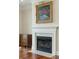 Living room with fireplace, hardwood floors, and a vintage painting with natural light at 341 Cooper River Dr, Mount Pleasant, SC 29464