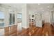 Open living space with hardwood floors, a kitchen island, and views to a separate living space at 341 Cooper River Dr, Mount Pleasant, SC 29464