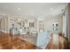 Open concept living room and kitchen with a cozy seating area, hardwood floors, and ample natural light at 341 Cooper River Dr, Mount Pleasant, SC 29464