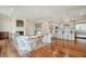 Spacious open-concept living room features a cozy fireplace, comfortable seating, and a kitchen with stainless appliances at 341 Cooper River Dr, Mount Pleasant, SC 29464