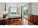 Main bedroom with hardwood floors, a four poster bed, large windows, and plenty of natural light at 341 Cooper River Dr, Mount Pleasant, SC 29464