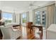 Light and airy main bedroom boasting hardwood floors, a ceiling fan, and balcony access at 341 Cooper River Dr, Mount Pleasant, SC 29464