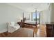 Spacious main bedroom with hardwood floors, comfortable seating, and natural light at 341 Cooper River Dr, Mount Pleasant, SC 29464
