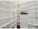 Walk-in pantry featuring rows of white shelving for organization and ample storage with hardwood floor at 341 Cooper River Dr, Mount Pleasant, SC 29464