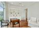 Sitting room with hardwood floors, built in shelving, table, and seating at 341 Cooper River Dr, Mount Pleasant, SC 29464