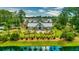 Aerial view featuring a central community gathering space with covered pavilion surrounded by verdant landscaping at 3697 Stamler Ct, Mount Pleasant, SC 29466