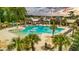 Beautiful community pool area with lounge chairs, palm trees, and ample space for swimming and sunbathing at 3697 Stamler Ct, Mount Pleasant, SC 29466