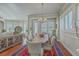 Dining room with hardwood floors, a rustic table, and decorative rug under a chandelier at 3697 Stamler Ct, Mount Pleasant, SC 29466