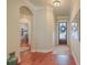 Bright foyer with hardwood floors, elegant archways, and decorative rug leading to open living spaces at 3697 Stamler Ct, Mount Pleasant, SC 29466