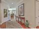 Hardwood foyer with arched doorways, elegant rug, and stylish decor leading to the home's living areas at 3697 Stamler Ct, Mount Pleasant, SC 29466