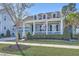 Charming blue two-story home with a covered front porch, complemented by well-manicured landscaping at 3697 Stamler Ct, Mount Pleasant, SC 29466