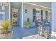Inviting front porch with comfortable seating and stylish lanterns, perfect for relaxing outdoors at 3697 Stamler Ct, Mount Pleasant, SC 29466