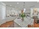 Spacious kitchen with white cabinets, granite countertops, island with bar seating, and modern appliances at 3697 Stamler Ct, Mount Pleasant, SC 29466