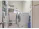 Functional laundry room features a washer, dryer, storage shelves, and tiled floor at 3697 Stamler Ct, Mount Pleasant, SC 29466