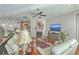 Cozy living room featuring fireplace, ceiling fan, and comfortable seating, perfect for relaxing and entertaining at 3697 Stamler Ct, Mount Pleasant, SC 29466