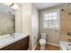 Bright bathroom with a tiled shower and tub, complemented by a modern vanity and fixtures at 3728 Tim St, North Charleston, SC 29405