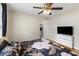 This bedroom has a ceiling fan and lots of natural light from a large window at 3728 Tim St, North Charleston, SC 29405