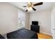 This bedroom features hardwood floors, a ceiling fan, and a black dresser at 3728 Tim St, North Charleston, SC 29405
