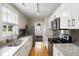 Modern kitchen features granite countertops, stainless steel appliances, and white cabinets at 3728 Tim St, North Charleston, SC 29405
