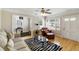 Bright living room with hardwood floors, zebra-striped rug, and stylish decor at 3728 Tim St, North Charleston, SC 29405