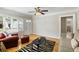 Inviting living room features hardwood floors, a ceiling fan, and neutral decor at 3728 Tim St, North Charleston, SC 29405