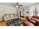 Well-lit living room showcasing hardwood floors, stylish furnishings, and ample space at 3728 Tim St, North Charleston, SC 29405