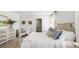 Neutral bedroom featuring decor, large windows, carpet flooring, and side tables at 384 Willows Crescent Dr, Moncks Corner, SC 29461