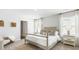 Spacious bedroom with neutral decor, large windows, and carpet flooring at 384 Willows Crescent Dr, Moncks Corner, SC 29461