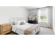 Well-lit bedroom with a cozy bed, two dressers, and a view from the window for a peaceful and inviting ambiance at 384 Willows Crescent Dr, Moncks Corner, SC 29461