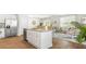 Modern kitchen open to living room featuring an island with granite countertops and stainless steel appliances at 384 Willows Crescent Dr, Moncks Corner, SC 29461