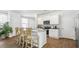 Bright and airy kitchen featuring granite countertops, an island with seating and modern appliances at 384 Willows Crescent Dr, Moncks Corner, SC 29461