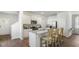 Modern kitchen with a granite island, white cabinetry, and stainless steel appliances at 384 Willows Crescent Dr, Moncks Corner, SC 29461