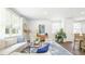 Bright living room featuring neutral furniture, large windows, and stylish décor, creating a welcoming atmosphere at 384 Willows Crescent Dr, Moncks Corner, SC 29461