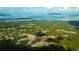 Expansive aerial view of Lake Moultrie neighborhood showcasing the homes, lake access, and verdant surrounding landscape at 406 Peachwood Ln, Moncks Corner, SC 29461