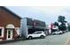 Charming street view shows various local businesses with street parking and sidewalks, reflecting the community's character at 406 Peachwood Ln, Moncks Corner, SC 29461