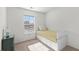 Bright bedroom features a daybed with built-in storage and a chest of drawers next to a window at 407 Burton Ave, Summerville, SC 29485