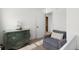 Comfortable room featuring an accent chair, green dresser, and a doorway that leads to another room at 407 Burton Ave, Summerville, SC 29485