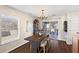 Cozy dining area featuring a stylish table, elegant chandelier, and access to the outdoor space at 407 Burton Ave, Summerville, SC 29485