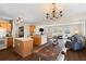 Open living area with a kitchen, dining space, hardwood floors, and plenty of natural light at 407 Burton Ave, Summerville, SC 29485